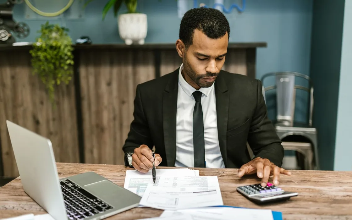 Business owner reviewing stock figures and reports at a desk
